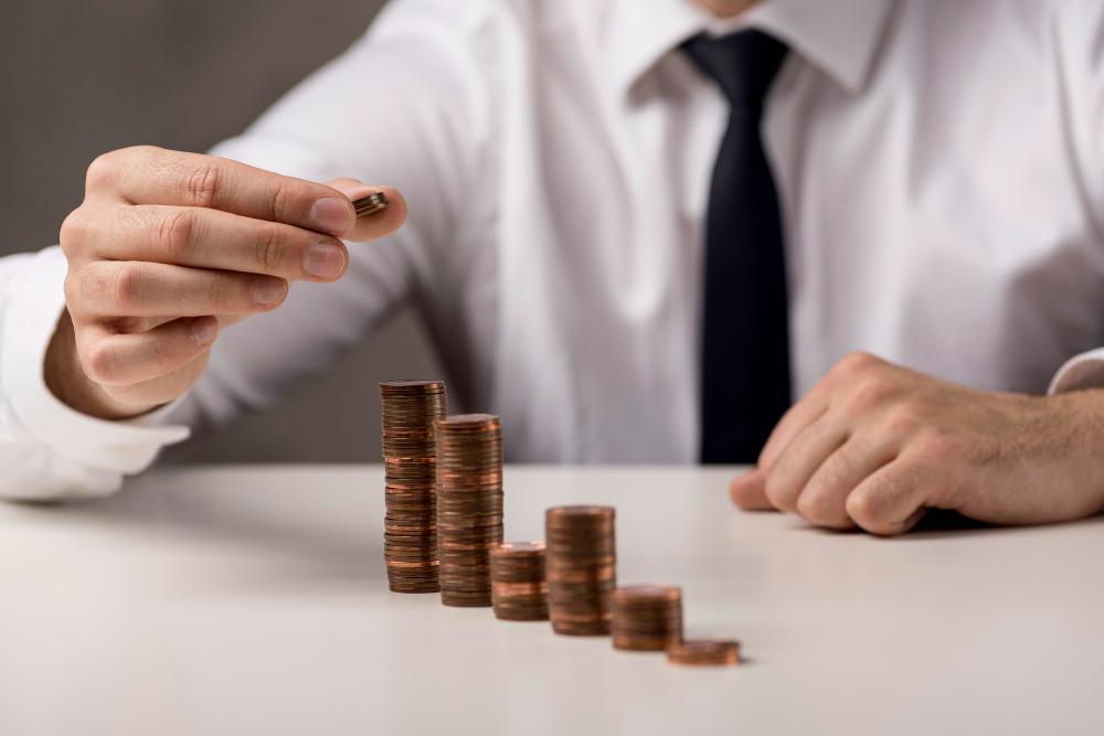 Professional stacking coins to illustrate salary progression for a Singapore PR application